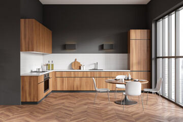 Front view on dark kitchen room interior with cupboard