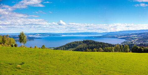Fototapeta na wymiar Panoramic view of a beautiful lake Mjosa and Gjovik city in summer. Norway