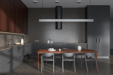 Side view on dark kitchen room interior with dining table