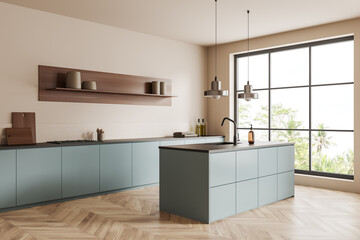 Light kitchen interior with bar countertop, cooking area near panoramic window