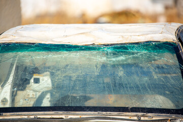 Broken car windshield. The car got a big hole in the windshield, an accident.