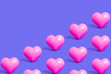 Minimal love, Valentine's Day idea. Seamless pattern of vivid pink hearts on purple  background.