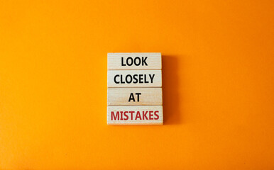 Look closely at mistakes symbol. Wooden blocks with words Look closely at mistakes. Beautiful...
