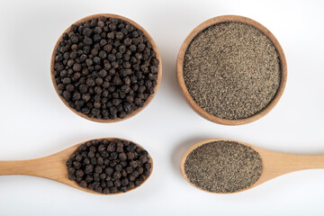 Ground black pepper with grains of black pepper on a white background,top view