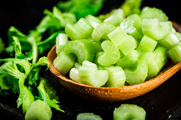 Fresh celery slices on a cutting board. 