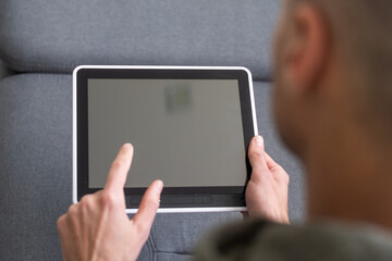 close up hands multitasking man using tablet, laptop and cellphone connecting wifi
