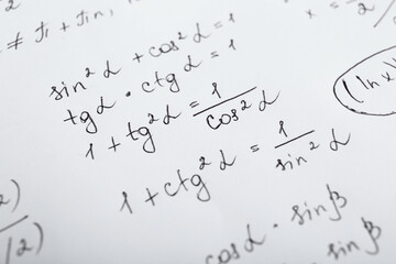 Sheet of paper with different mathematical formulas, closeup