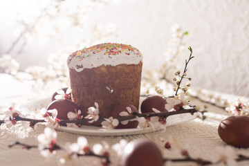 Easter cake and painted eggs blooming branch