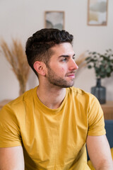 man sitting on sofa in living room