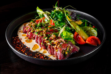 Roast  beef salad with vegetables on plate