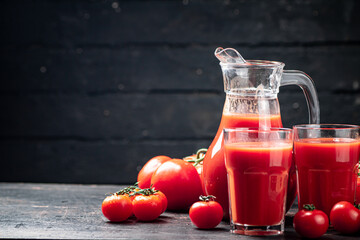 Juice from ripe tomatoes on the table. 