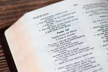Psalm 123 verses in open holy bible book, a closeup. - obrazy, fototapety, plakaty