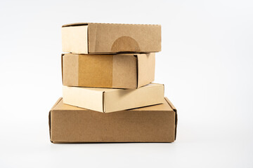 stack of used cardboard  mailling storage boxes ready for recycling into new products isolated on white background