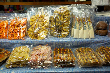 Dried fish and seafood on the market in Thailand. Delicious delicacies of sea fishing.