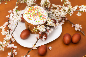 Colorful Easter eggs with spring blossom flowers. Colored Egg Holiday border. Easter cake
