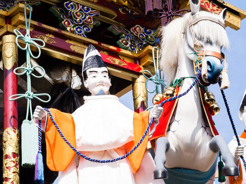 Takayama, Japan - October 9, 2015: Wooden doll figures on top of decorative float during Autumn Takayama Festival