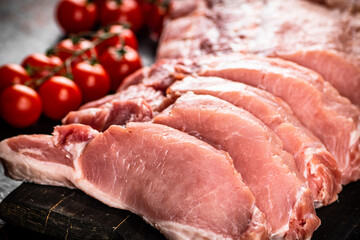 Sliced pork raw on a cutting board. 