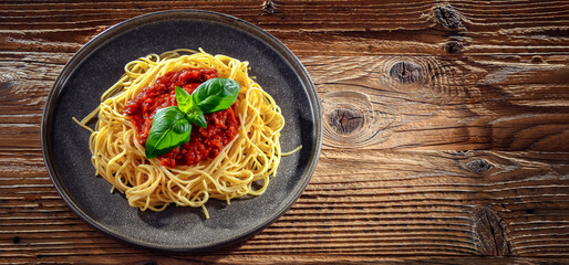 Composition with a plate of spaghetti bolognese