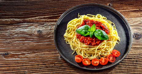 Composition with a plate of spaghetti bolognese