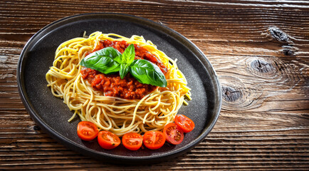 Composition with a plate of spaghetti bolognese