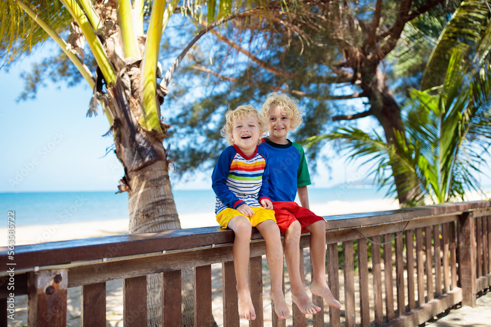 Wall mural kids at tropical beach. child on summer vacation.