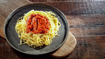 Composition with a plate of spaghetti bolognese
