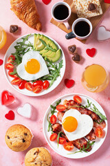 Couple breakfast on Valentines Day on pink background, top view