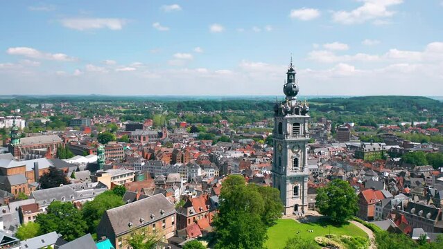 Aerial summer skyline panorama of the old town of Mons (Bergen). The Belfry of Mons (Beffroi de Mons) in the foreground. Wallonia, capital of Hainaut, Belgium. 