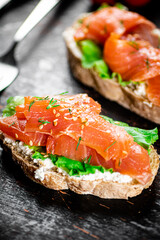 Sandwich with salmon and herbs. 