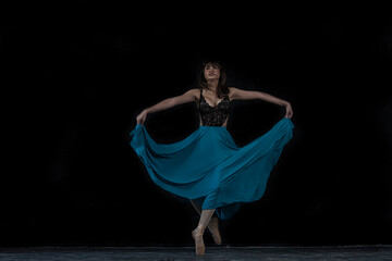 woman dancing. woman dancing in the studio. young ballerina with a perfect body is dancing in a photo studio, dancers are dressed in fashionable outfits.  © ENGINEER - STUDIO