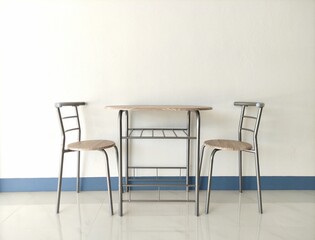 wood table and chair on white wall