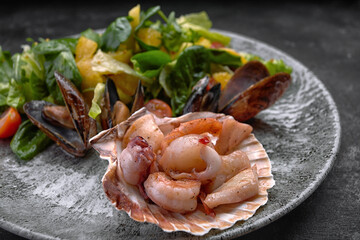 Seafood cocktail on a plate with herbs and tomatoes