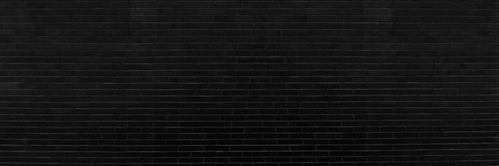 Dark black brick wall Is the background of the room that has textures Of old antique plaster grunge