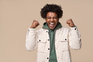 Happy excited lucky African teen winner student boy feeling joy, screaming, celebrating great...