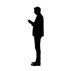 Silhouette of a man using a cell phone