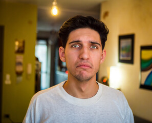 Fototapeta premium Pensive Handsome Young Man with Sad Face