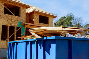 As part of construction site waste removal process metal container used for recycling garbage trash...