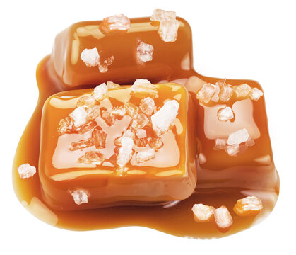 Salty Caramel Candies In Milk Caramel Sauce With Salt Crystals Isolated On White Background.