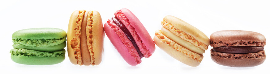 Colorful french macarons isolated on white background.