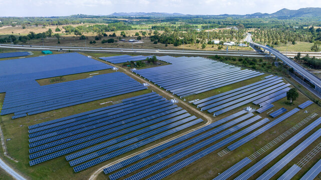  Blue Solar panel farm or solar power plantation.  Alternative renewable energy with photovoltaic cell industry. Green energy technology for future world concept,