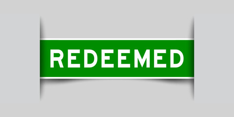 Green color square label sticker with word redeemed that inserted in gray background