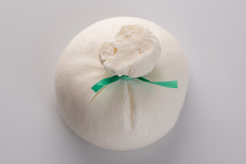 Burrata - Italian cheese, which is an excellent combination of mozzarella and cream on white background