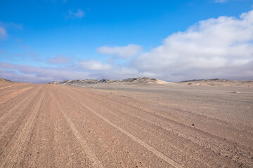 Fototapeta na wymiar Gravel road in Skeleton Coast Park, Namibia. 