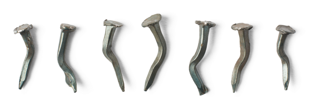 set of unusable and warped nails isolated background, bent and broken steel construction fastening material, failure concept, collection