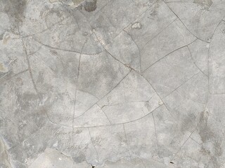 Stained and cracked vintage cement horizontal background texture in monochromatic gray