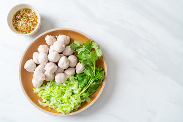 pork meatball with vegetable and spicy sauce