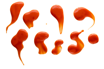 Set of red drops and splashes of ketchup or sauce isolated on white background. With clipping path. Full depth of field. Focus stacking