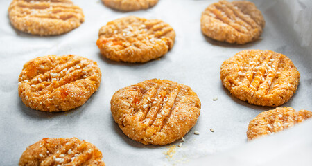 Cooking homemade cookies from oatmeal, banana and dried apricots. Diet cookies on parchment. A healthy snack. Proper nutrition.