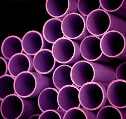 Background of the pink plastic pipes in stacked