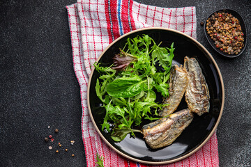 sardine salad green mix lettuce leaves healthy meal food snack on the table copy space food background rustic top view